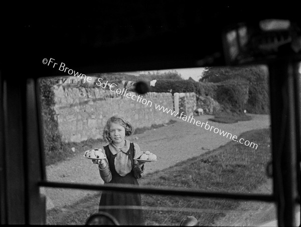 THROUGH WINDSCREEN GIRL SELLING BUNS